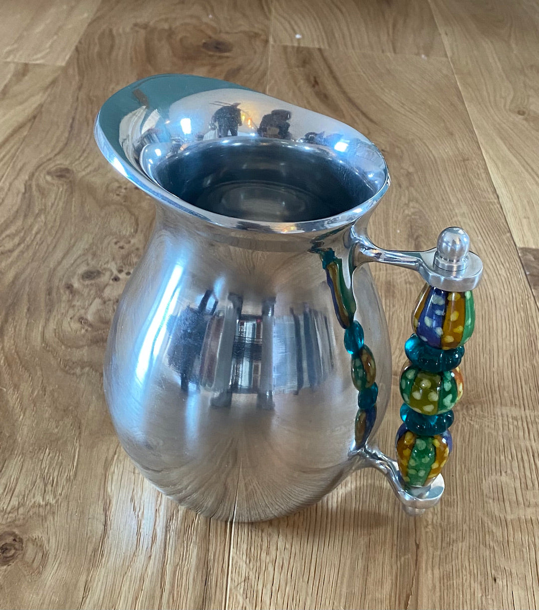 Jug with beaded or ceramic handle