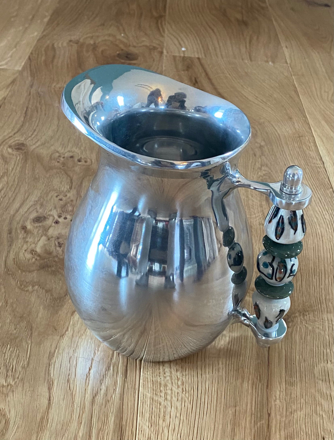 Jug with beaded or ceramic handle