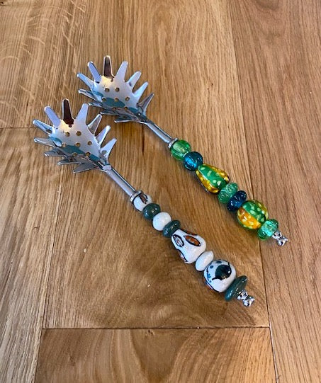 Pasta serving spoon with beaded or ceramic handle